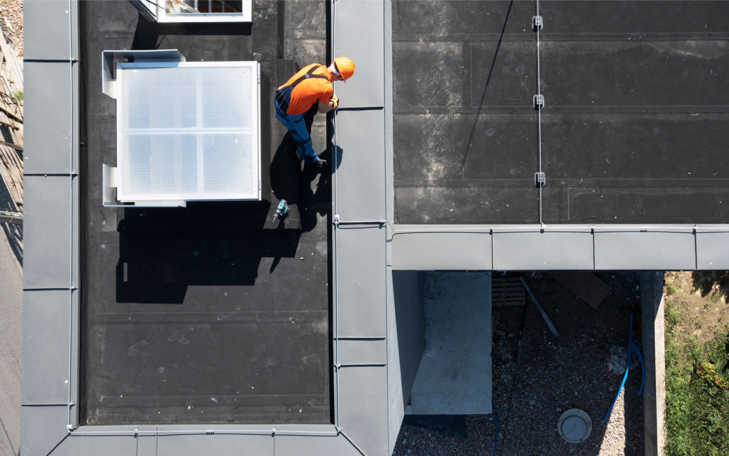 Worker Repairing Epdm Roof